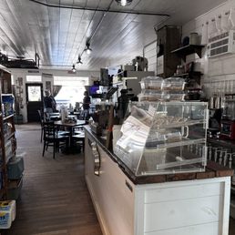 Specialty coffee bar with dining area in background Specialty coffee bar with dining area in background