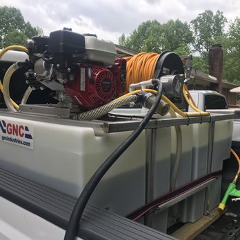 Turf Brothers - the back end of a truck with a hose attached to it - Lawn Services Near Me Turf Brothers - the back end of a truck with a hose attached to it - Lawn Services Near Me