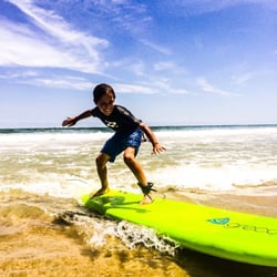 Surf City Surf School - Liam shredding, learning and smiling during his first lesson with the Surf City Surf School.