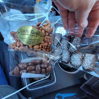 Rancho Ravari Almonds & Gifts - a person grabbing a bag of nuts - Candy Stores Near Me - Tehachapi, California Rancho Ravari Almonds & Gifts - a person grabbing a bag of nuts - Candy Stores Near Me - Tehachapi, California