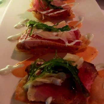 Peohe's - Ahi poke nachos - nice slice of seared ahi served on a wonton chip w/ drizzle of wasabi cream sauce - very tasty - Seafood Near Me - Coronado, California Peohe's - Ahi poke nachos - nice slice of seared ahi served on a wonton chip w/ drizzle of wasabi cream sauce - very tasty - Seafood Near Me - Coronado, California