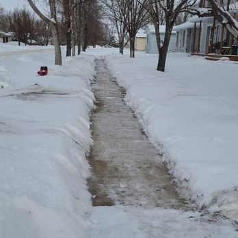 Km Seasonal Services - a snow covered street - Snow Removal Near Me - Winkler, Manitoba Km Seasonal Services - a snow covered street - Snow Removal Near Me - Winkler, Manitoba