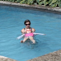 AquaMobile Swim School - Instructor Bree teaching her student how to float