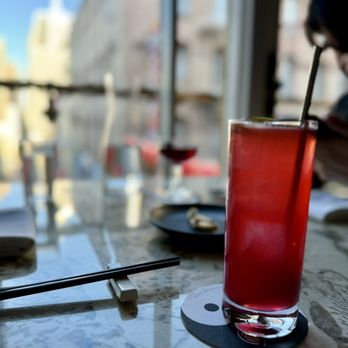 Mister Jiu's - a red drink on a table - Chinese Near Me - San Francisco, California Mister Jiu's - a red drink on a table - Chinese Near Me - San Francisco, California
