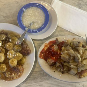 Breakfastime - Bananas foster French toast with grits and home fries sautéed with onions - Breakfast & Brunch Near Me - Winston-Salem, North Carolina