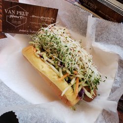 Vegan hot dog with broccoli slaw and sprouts