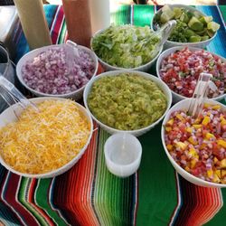 Taqueria 805 - Our Taco bar buffet with Salsas, Cheese, Guacamole, Mango pico de Gallo, Regular Pico De Gallo, Lettuce, Onions, and limes.