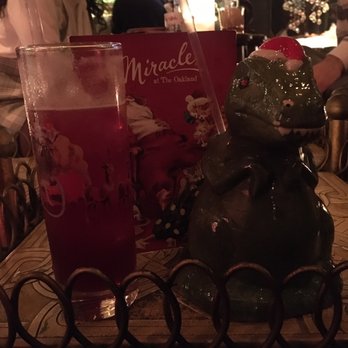 The Oakland - Champagne and mulled wine with the T-Rex!  Miracle themed for the holidays! - Cocktail Bars Near Me - Ferndale, Michigan