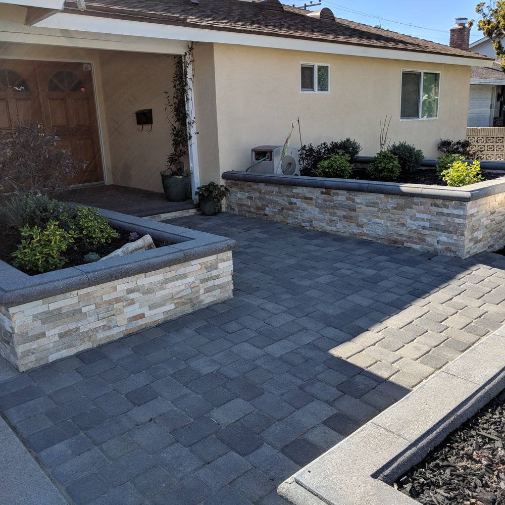 Three planters with rock facing plus paver walkway and entryway. Three planters with rock facing plus paver walkway and entryway.