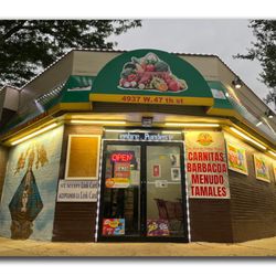 Los Primos Fresh Market & Taqueria - Store front of establishedment shot from a low angle and from the corner.