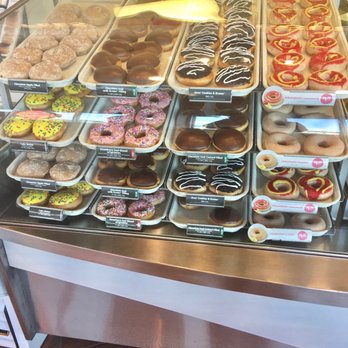 Krispy Kreme - a variety of donuts on display - Donuts Near Me - San Marcos, Texas