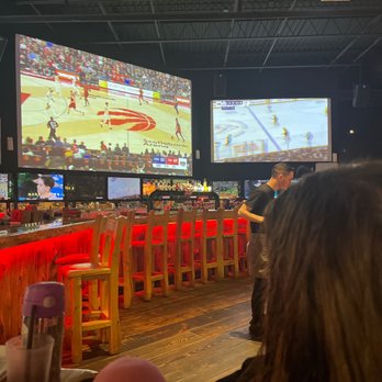 Gametime Eatery & Entertainment - people sitting at a bar - Sports Bars Near Me - Mississauga, Ontario Gametime Eatery & Entertainment - people sitting at a bar - Sports Bars Near Me - Mississauga, Ontario