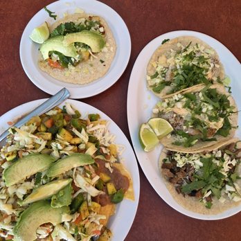 El Cuate Mexican Restaurant - Vegetarian nachos (left), vegetarian taco (top), plate of 2 fish tacos and 1 carne asada taco (right) - Mexican Near Me - Hood River, Oregon El Cuate Mexican Restaurant - Vegetarian nachos (left), vegetarian taco (top), plate of 2 fish tacos and 1 carne asada taco (right) - Mexican Near Me - Hood River, Oregon