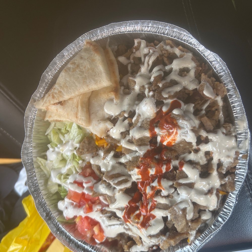 Regular Beef Gyro Platter with white sauce and hot sauce. Bussin! Regular Beef Gyro Platter with white sauce and hot sauce. Bussin!