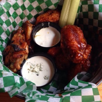 Jake Melnick's Corner Tap - Ponchos jumbo bone-in wings on the left, BBQ on the right. - Sports Bars Near Me - Chicago, Illinois Jake Melnick's Corner Tap - Ponchos jumbo bone-in wings on the left, BBQ on the right. - Sports Bars Near Me - Chicago, Illinois
