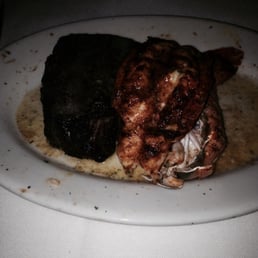 My pitiful lobster tail. Couldn't have been larger than 3 fingers together. Steak was awesome.