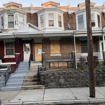 M R Landscape Services - a row of houses with boarded windows - Landscaping Near Me M R Landscape Services - a row of houses with boarded windows - Landscaping Near Me