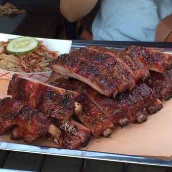 Cherry Street BBQ - Full rack of ribs with an order of pulled pork in the corner. - Barbeque Near Me - Toronto, Ontario Cherry Street BBQ - Full rack of ribs with an order of pulled pork in the corner. - Barbeque Near Me - Toronto, Ontario