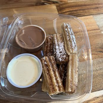 Sweet Stax Cafe - Churros with white and milk chocolate, churros dusted in cinnamon and powdered sugar - Desserts Near Me - Lynn Haven, Florida Sweet Stax Cafe - Churros with white and milk chocolate, churros dusted in cinnamon and powdered sugar - Desserts Near Me - Lynn Haven, Florida