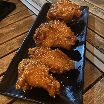 DOMU - Domu wings - Kimchi butter sauce and sesame seeds - Ramen Near Me - Orlando, Florida DOMU - Domu wings - Kimchi butter sauce and sesame seeds - Ramen Near Me - Orlando, Florida