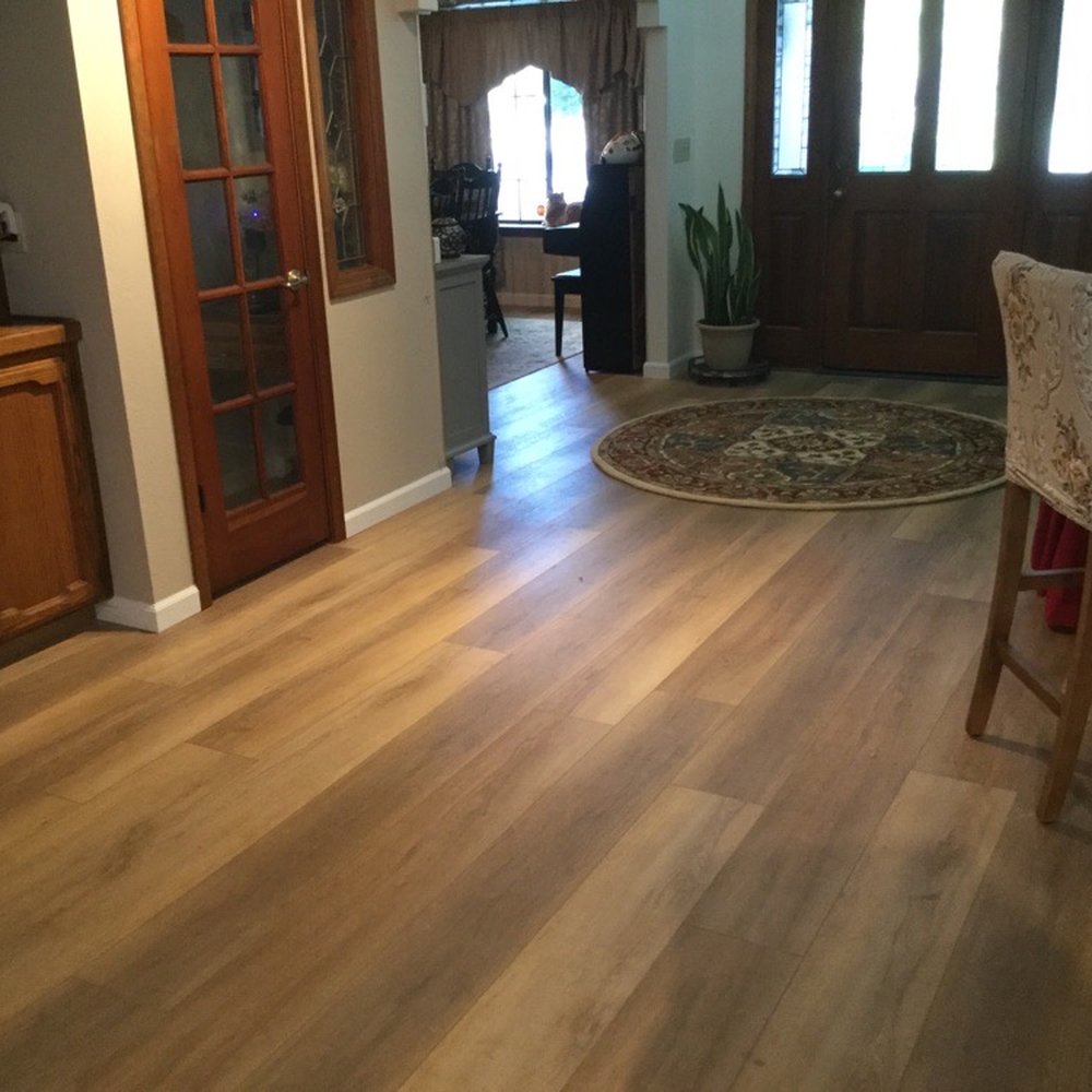 Flooring Liquidators - Replaced mix of carpet and ceramic tile with continuous wood flooring. - Flooring Near Me - Clovis, California