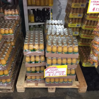 Jomara Wholesale - a display of jars of orange juice - Grocery Near Me - Hialeah, Florida