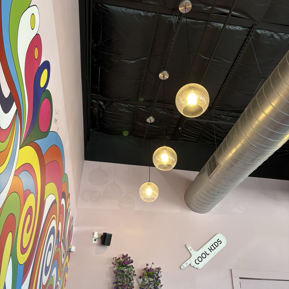 Neon Belly Coffee & Bakery - Cool Kids Corner offers comfy hot pink love seats and a table just the right height for a laptop - Coffee & Tea Near Me - Austin, Texas Neon Belly Coffee & Bakery - Cool Kids Corner offers comfy hot pink love seats and a table just the right height for a laptop - Coffee & Tea Near Me - Austin, Texas
