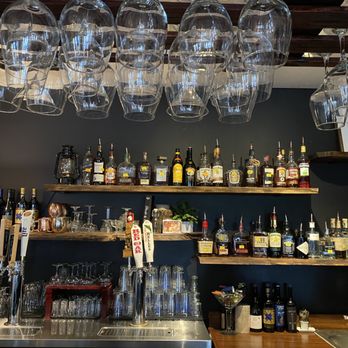 The Cabin Pub - a bar with wine glasses hanging from the ceiling - Wine Bars Near Me - Davidson, North Carolina The Cabin Pub - a bar with wine glasses hanging from the ceiling - Wine Bars Near Me - Davidson, North Carolina