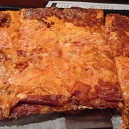 a piece of pizza on a tray a piece of pizza on a tray