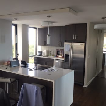 Masterpiece Kitchens - Once walled in and isolated now open concept "Bachelor Pad" - General Contractors Near Me