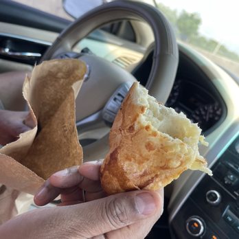 La Colina Restaurant - a person holding a pastry in their hand - Colombian Near Me - Hollywood, Florida La Colina Restaurant - a person holding a pastry in their hand - Colombian Near Me - Hollywood, Florida
