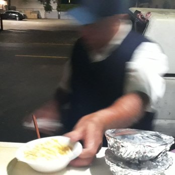 Corn Man - Husked gold in a bowl. The cobbed corn sold out first on this night. - Food Stands Near Me - Los Angeles, California