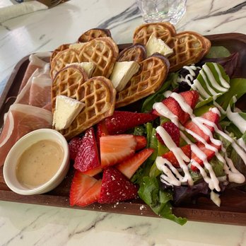 Waffleland Cafe - Charcuterie board - prosciutto, Brie, waffle, strawberries and salad - Waffles Near Me - Vancouver, British Columbia Waffleland Cafe - Charcuterie board - prosciutto, Brie, waffle, strawberries and salad - Waffles Near Me - Vancouver, British Columbia