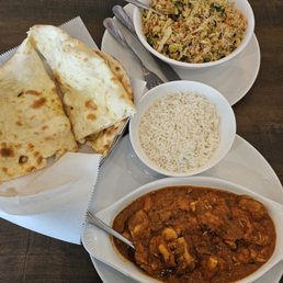 Naan (bread), Vegetable Fried Rice (top), Chicken Curry with white Basmati Rice (bottom) Naan (bread), Vegetable Fried Rice (top), Chicken Curry with white Basmati Rice (bottom)