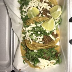 Tacos El Guero - Three steak tacos with cheese.