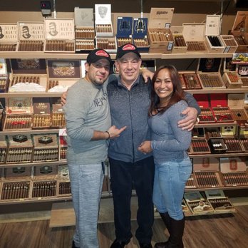 The Cave Cigar Lounge - two men and a woman posing for a picture - Cigar Bars Near Me - Newark, New Jersey The Cave Cigar Lounge - two men and a woman posing for a picture - Cigar Bars Near Me - Newark, New Jersey