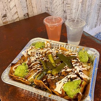 tacoria - Hoboken - Viva la Nachos (full-size) with carne asada and guacamole, guava drink, and limonada drink - Mexican Near Me - Hoboken, New Jersey tacoria - Hoboken - Viva la Nachos (full-size) with carne asada and guacamole, guava drink, and limonada drink - Mexican Near Me - Hoboken, New Jersey