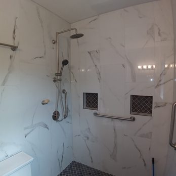 JE Remodeling Solutions - a bathroom with a shower and toilet - General Contractors Near Me - Bothell, Washington