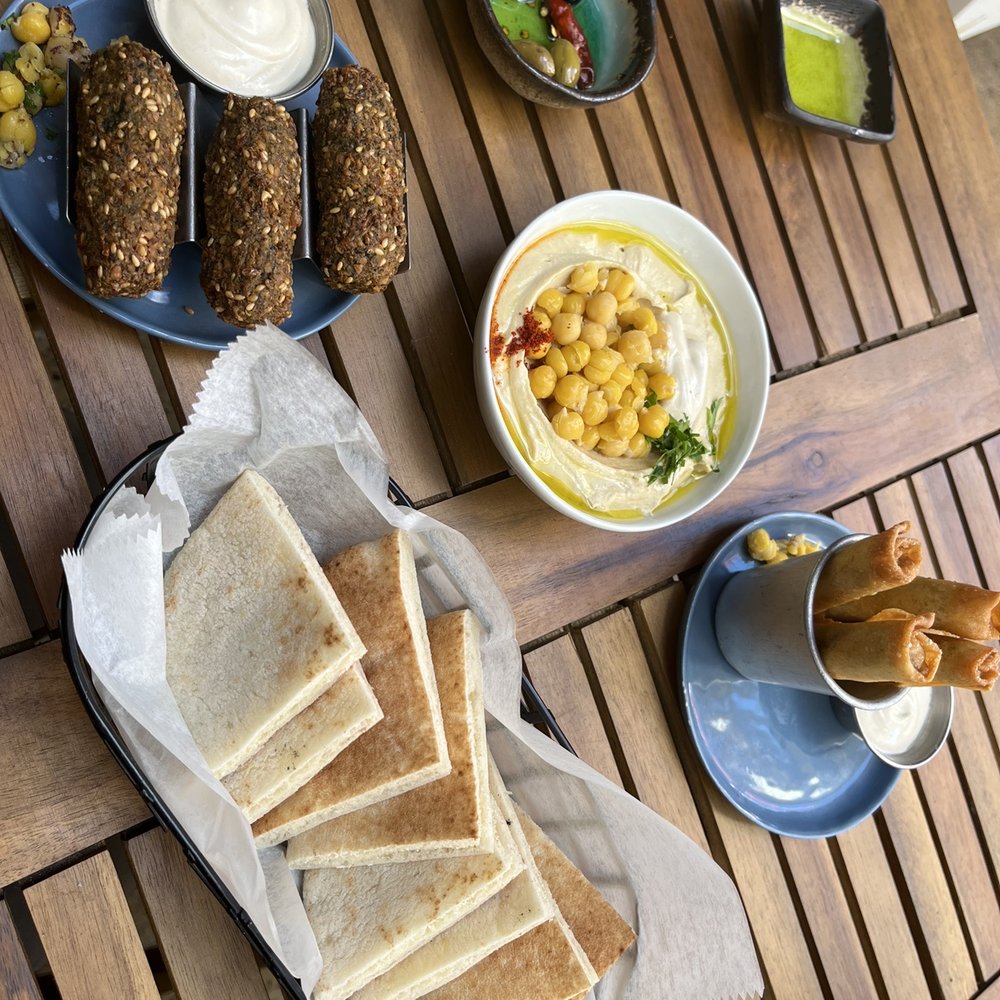 Hummus Kitchen - Mazze Trio with Falafel, hummus w/ pita, vegetable cigars with tahini - Middle Eastern Near Me - New York, New York Hummus Kitchen - Mazze Trio with Falafel, hummus w/ pita, vegetable cigars with tahini - Middle Eastern Near Me - New York, New York
