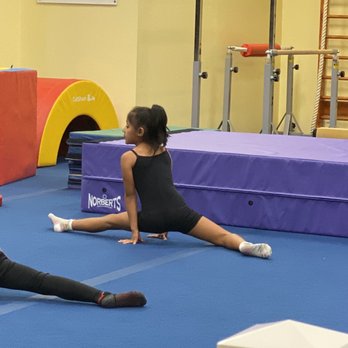 American Flips Kids Gymnastics - 7 yr old practicing slit stretch. - Gymnastics Near Me - Cypress, California American Flips Kids Gymnastics - 7 yr old practicing slit stretch. - Gymnastics Near Me - Cypress, California