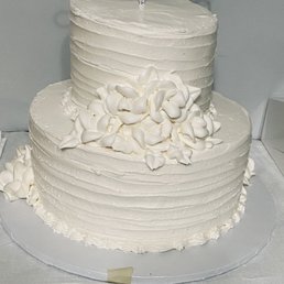 Top tier pineapple bottom strawberry with buttercream icing