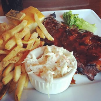 McGlynn's Pub & Restaurant - Half rack of Ribs with fries and Cole slaw. - American Near Me - Dover, Delaware McGlynn's Pub & Restaurant - Half rack of Ribs with fries and Cole slaw. - American Near Me - Dover, Delaware