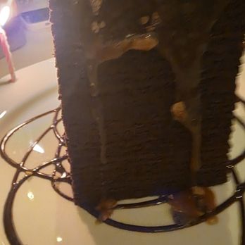 B-Prime Steakhouse - Mile hight chocolate cake topped with a hazelnut Carmel sauce, delicious - Steakhouses Near Me - Atlantic City, New Jersey B-Prime Steakhouse - Mile hight chocolate cake topped with a hazelnut Carmel sauce, delicious - Steakhouses Near Me - Atlantic City, New Jersey