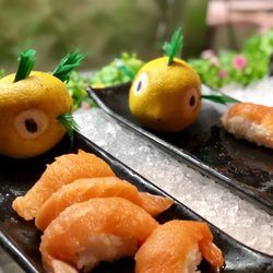 Fresh carved fruit around the seafood