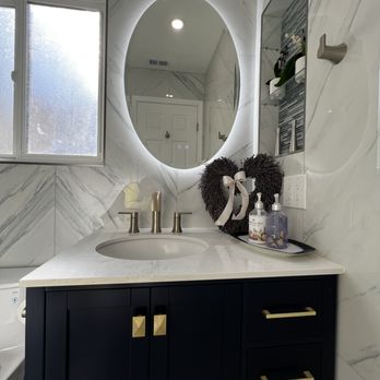 Gilmore Construction - Creative way to repurpose the original medicine cabinet - General Contractors Near Me