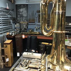 Wind & Brass - Pieces of a tuba and the tools to put it back together.