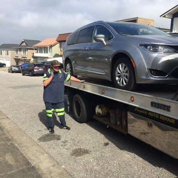 Miller & O'brien Towing - Brent with my Pacifica loaded onto his tow truck. - Body Shops Near Me - Pacifica, California