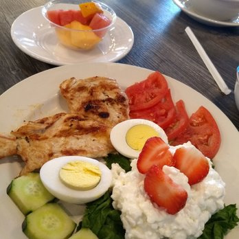 Hydeout Cafe - This is the Diet Delight. It is wonderful. It has chicken breast, cottage cheese, a boiled egg, tomato, fresh fruit, and cucumber. - Breakfast & Brunch Near Me - McKinney, Texas