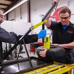Spartan College of Aeronautics and Technology - AMT students changing a tire