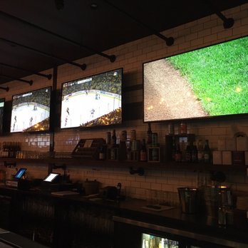 Emblem - 6 screens over the bar .... might want to label which games will be shown for busy sports days - Sports Bars Near Me - Brooklyn, New York